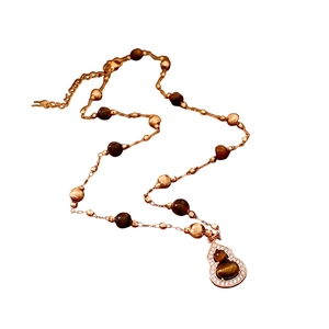 Rose gold tiger eye bead necklace with a crystal-encrusted Wu Lou gourd pendant