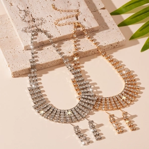 Luxe crystal tassel necklace and earrings set in gold and silver finish on stone