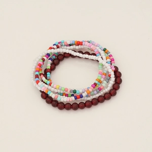 Macro shot of bohemian seed bead bracelet set with multi-layer colorful beads