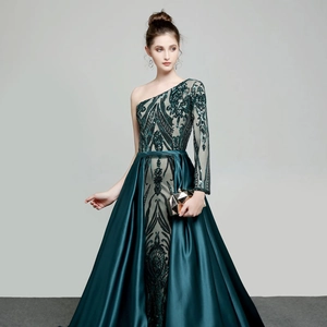 Elegant emerald green one-shoulder sequin evening gown with side slit and satin train
