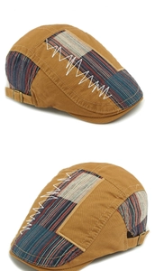 Détail de casquette rétro kaki avec patchwork rayé coloré et couture en zigzag blanc