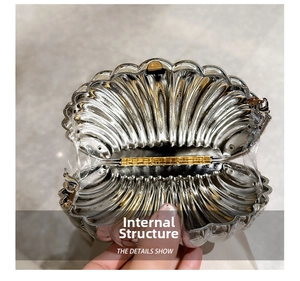 Detail showing the internal structure and silver shell shape of this evening bag