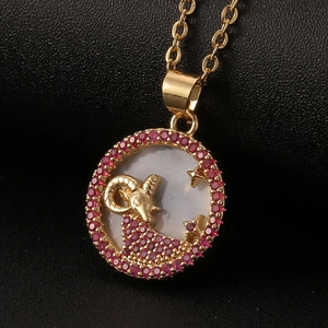 Golden Aries zodiac necklace with red zircon frame and white shell pendant inlay