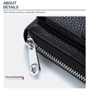 Detailed macro view of black lychee leather purse texture with silver star zipper detail