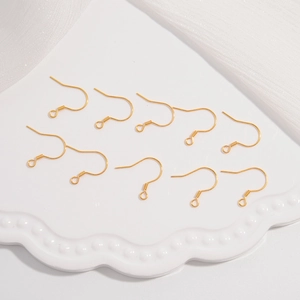 Ten pieces of gold-plated S925 sterling silver ear hooks on a white wavy display tray