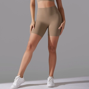 Close-up of high-waisted yoga shorts in mocha with side pockets and seamless fit