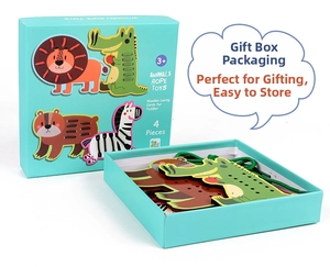 Detail of wooden animal lacing cards with threading strings in a blue gift box