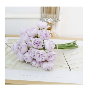 Detail of artificial purple multi-head roses tied with rustic hemp rope for decor
