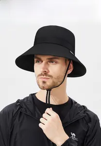 Detail view of black waterproof outdoor sun hat with adjustable windproof cord and wide brim