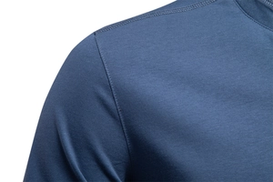Macro shot of double-stitched shoulder seam on a grey-blue business casual shirt