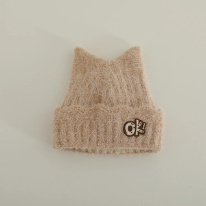 Detail of soft khaki plush knit hat featuring cat ear design and OK! embroidery patch
