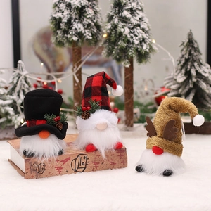 Three glowing Christmas gnomes with LED lights for festive holiday tree decoration