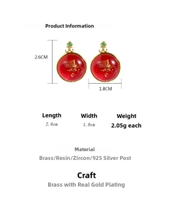 Detail view of vintage red resin earrings with gold leaf and 2.6cm by 1.8cm size dimensions