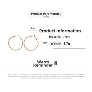Rose gold geometric hoop earrings detail with 4cm diameter and 5.7g weight specification