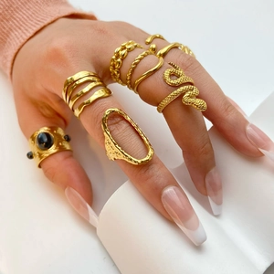 Set of minimalist 18K gold plated stainless steel geometric rings worn by a model