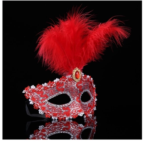 Close-up of red and silver masquerade mask featuring delicate lace, feathers and gemstone