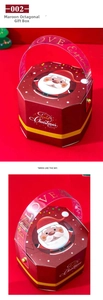 Detail view of burgundy octagonal Christmas gift box with Santa Claus and plastic handle