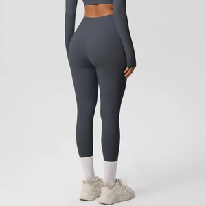Detail view of high-waisted dark grey yoga leggings showing butt-lifting effect and fabric texture