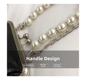 Detail of pearl handle and silver chain strap on a textured black leather handbag