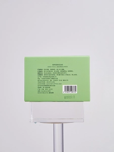 Close-up of green tea oil blotting sheets packaging showing ingredients and usage info