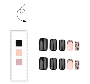 Short square press-on nails featuring black, pink, and leopard print art patterns
