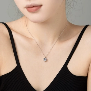 Detail showing a white solitaire zircon pendant on a S925 sterling silver chain