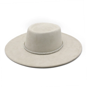 Close-up of elegant pearl trim on beige suede-textured wide brim fedora hat