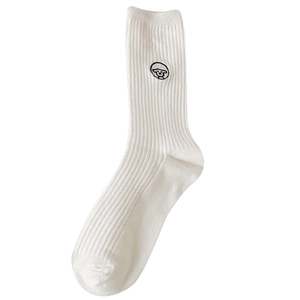 White cotton mid-calf socks with black cartoon embroidery and ribbed texture