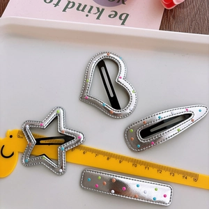 Set of four silver leather hair clips with colorful dots in star, heart and oval shapes