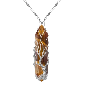 Detailed view of Tree of Life silver wire wrap on hexagonal Tiger Eye stone pendant