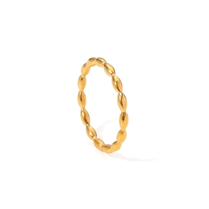 French minimalist golden titanium steel ring with textured bead pattern on white background