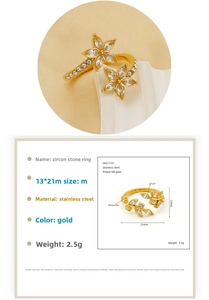 Detail of 18K gold plated stainless steel ring with leaf pattern and cubic zirconia