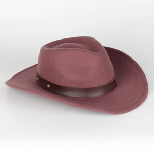Detail of dusty rose wool fedora featuring a brown leather band with gold metal studs