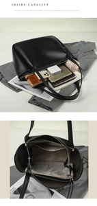Macro shot showing internal compartments and large storage capacity of black tote bag