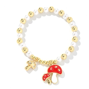 Chic beaded bracelet with white pearls, gold beads, and cute red mushroom charms