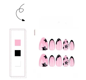 Close-up of pink almond press-on nails with black stars and French tip designs