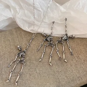 Gothic skull jewelry set with vintage silver necklace and tassel earrings in punk style