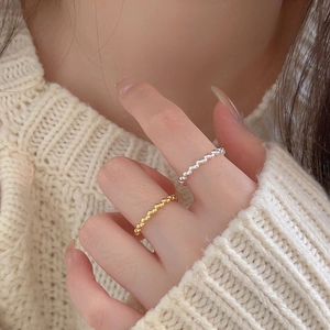 Minimalist 925 sterling silver beaded rings in gold and silver finish on hand