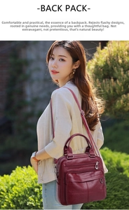 Close-up of wine red faux leather backpack with double front zippers in a garden setting