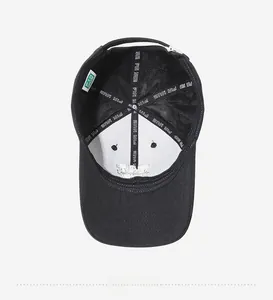 Internal view of black baseball cap with PIN NUE reinforced straps and brand label