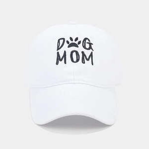 Detail of white washed cotton baseball cap with black embroidered DOG MOM text and paw print