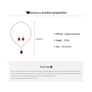 Detailed specs of teardrop copper jewelry set with red rhinestones and sizing info