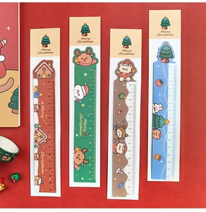 Detailed view of four 15cm Christmas rulers with reindeer and gingerbread house motifs