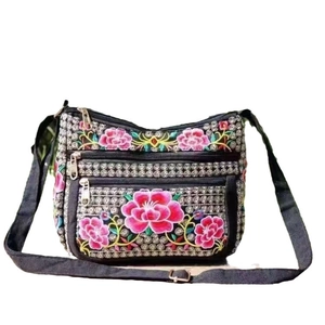 Ethnic style canvas crossbody bag with floral embroidery and three zipper pockets