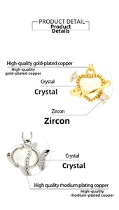 Close-up of gold-plated heart planet and silver fish pendants with zircon and crystal
