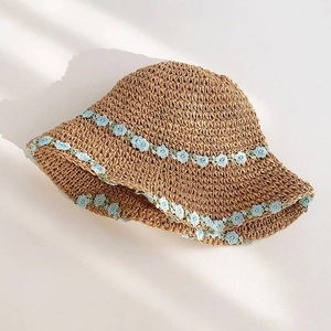 Straw sun hat with light blue floral embroidery and wide brim for summer beach vacation