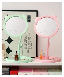 Pink and green cat-ear desktop vanity mirrors with round storage bases for jewelry
