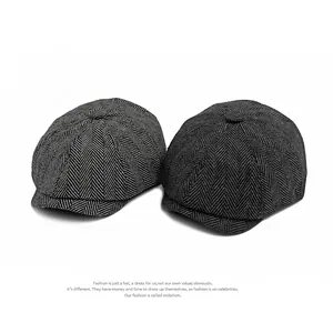 Classic herringbone newsboy caps in light and dark grey textured wool fabric