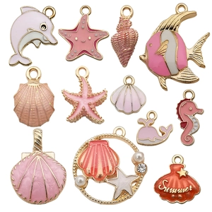 Detail of 12pcs pink enamel ocean pendants including starfish shell and seahorse