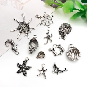 Detail of silver alloy ocean charms including starfish and turtle for DIY jewelry making